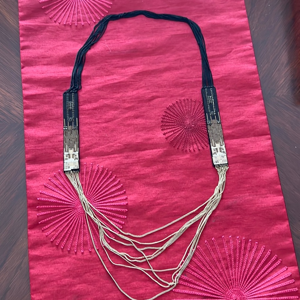 Beautiful black and gold necklace. Great for a night out.